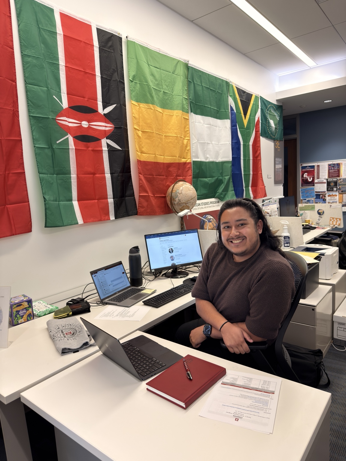 Louis Gallegos working at a desk at the Hamilton Lugar School